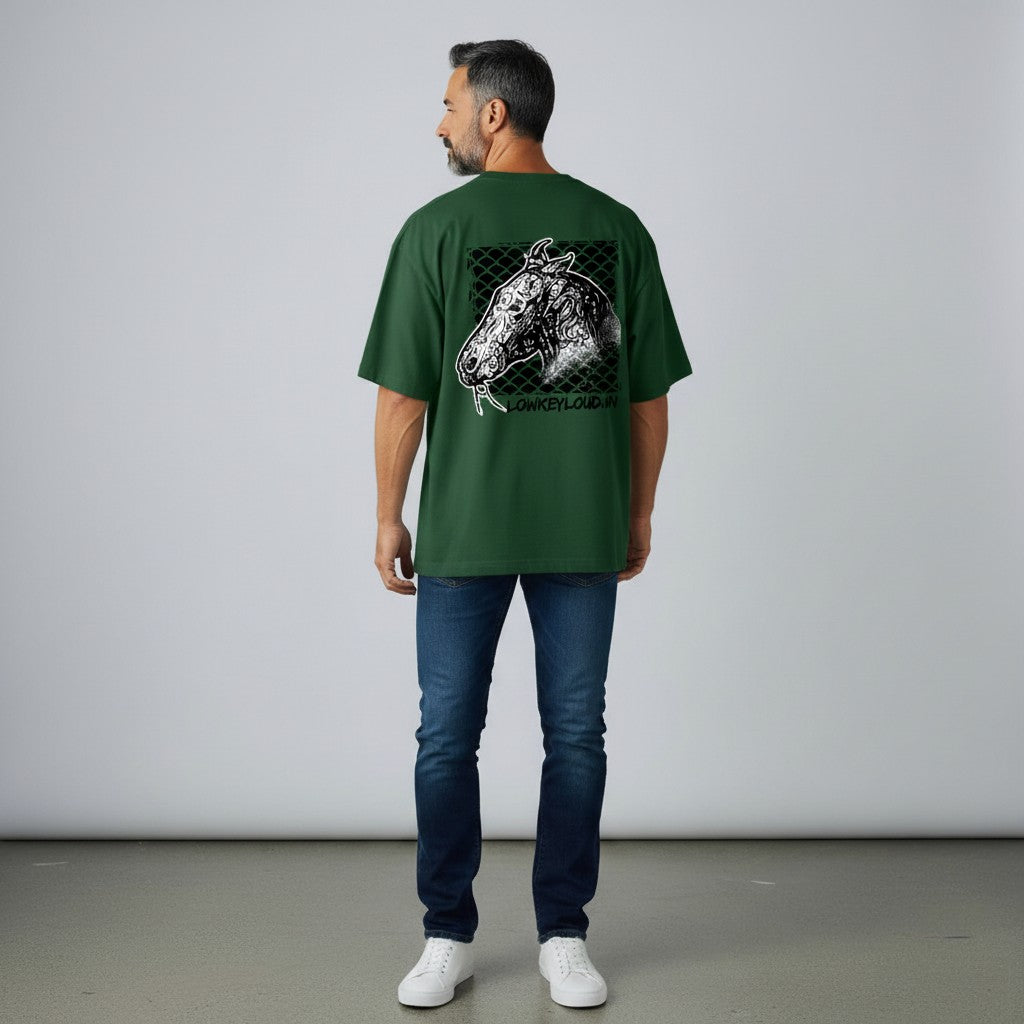 Man wearing a green t-shirt with a horse graphic on the back, standing against a plain background.