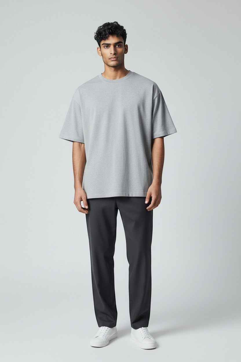 LowKeyLoud grey heather cotton blend oversized unisex t-shirt with a round neck and short sleeves. Features a back print.